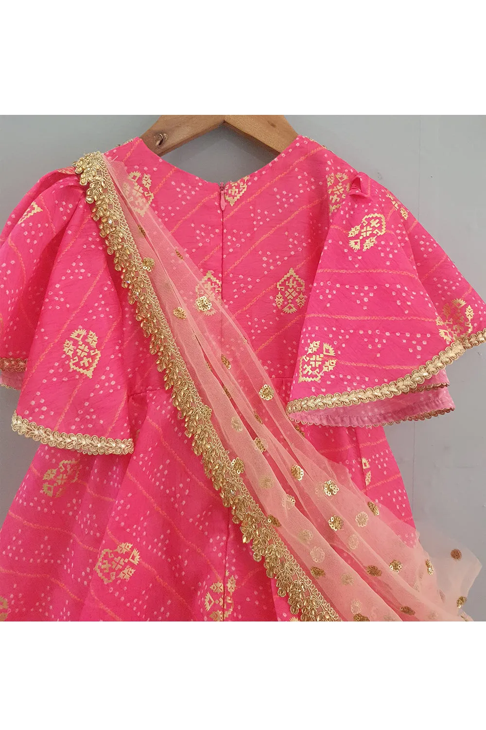 Hot pink bandhani printed layered anarkali with attached dupatta