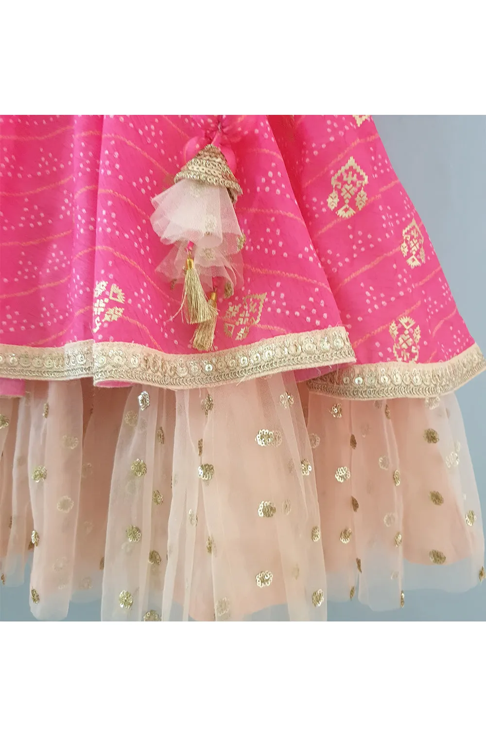 Hot pink bandhani printed layered anarkali with attached dupatta